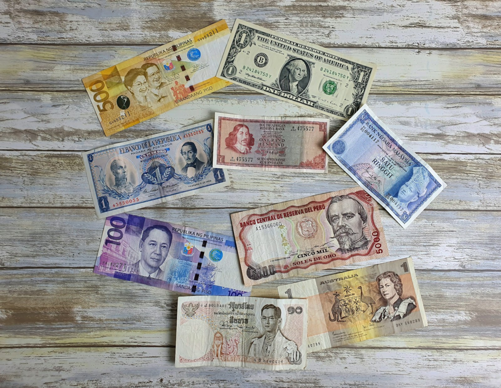 Assorted foreign currency notes representing forex planning for Indian students studying abroad