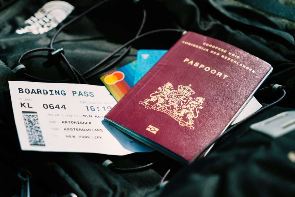 Indian passport and boarding pass laid out as part of a pre-departure checklist for Indian students