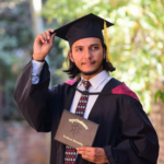 Graduate holding degree certificate representing successful study abroad outcome