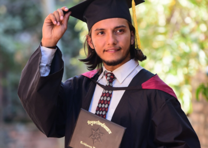 Graduate holding degree certificate representing successful study abroad outcome