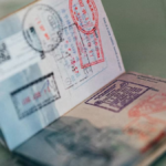 Passport with visa stamps representing the New Zealand student visa application process for Indian students