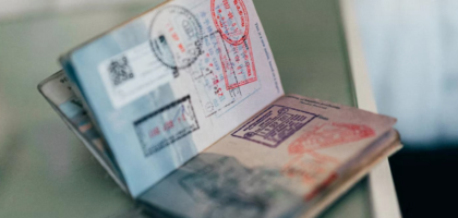 Passport with visa stamps representing the New Zealand student visa application process for Indian students
