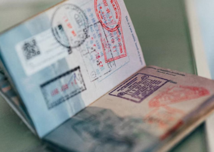 Passport with visa stamps representing the New Zealand student visa application process for Indian students