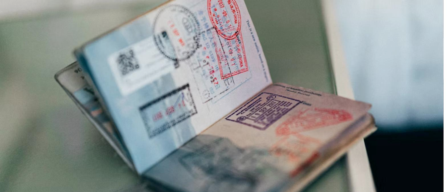 Passport with visa stamps representing the New Zealand student visa application process for Indian students