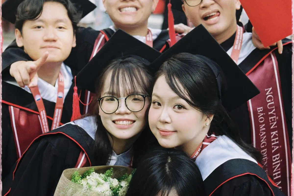 Graduates celebrating with diplomas after finishing an Irish university masters