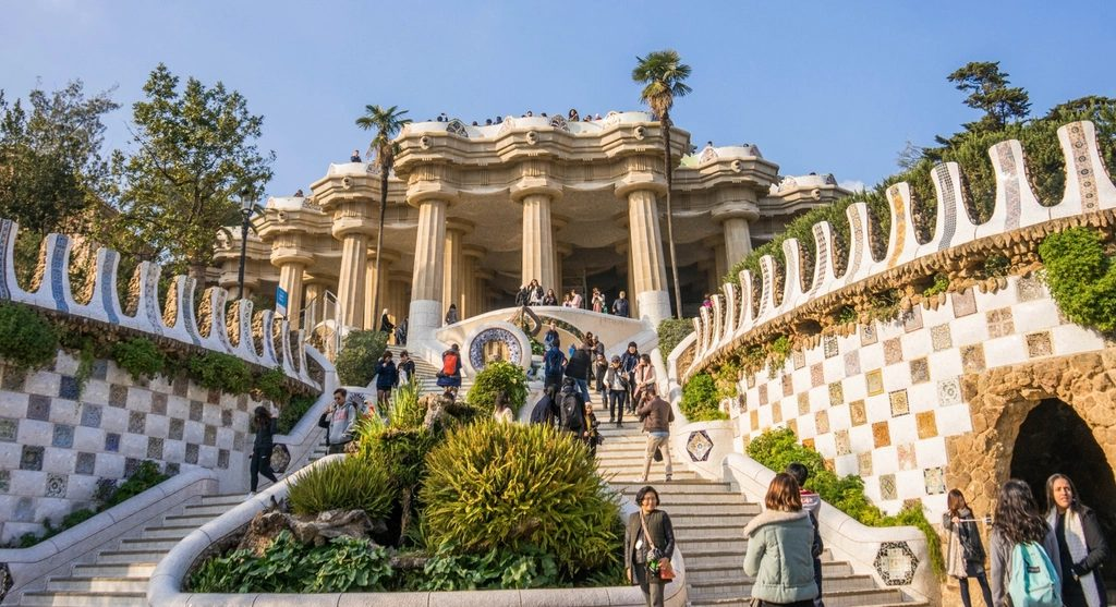 Visitors on the Gaudi staircase at Park Guell in Barcelona, Spain