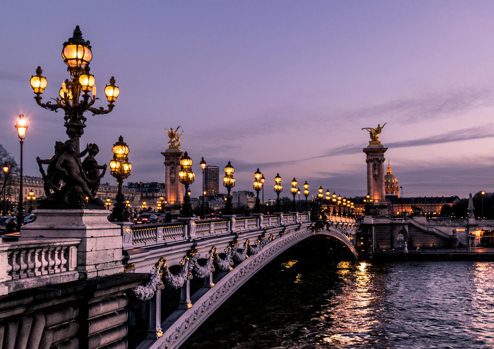 Pont Alexandre III lit at night, a symbol of student life when you study in France 2026