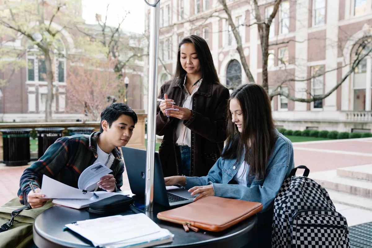 University students outside a modern campus building, University College Dublin