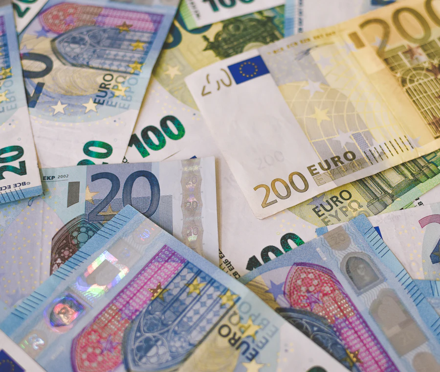 Euro banknotes showing the low cost of public university tuition to study in Italy 2026