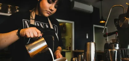 Cost of living for international students: a student working a part-time cafe shift