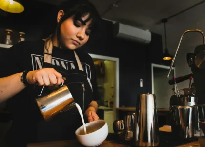 Cost of living for international students: a student working a part-time cafe shift