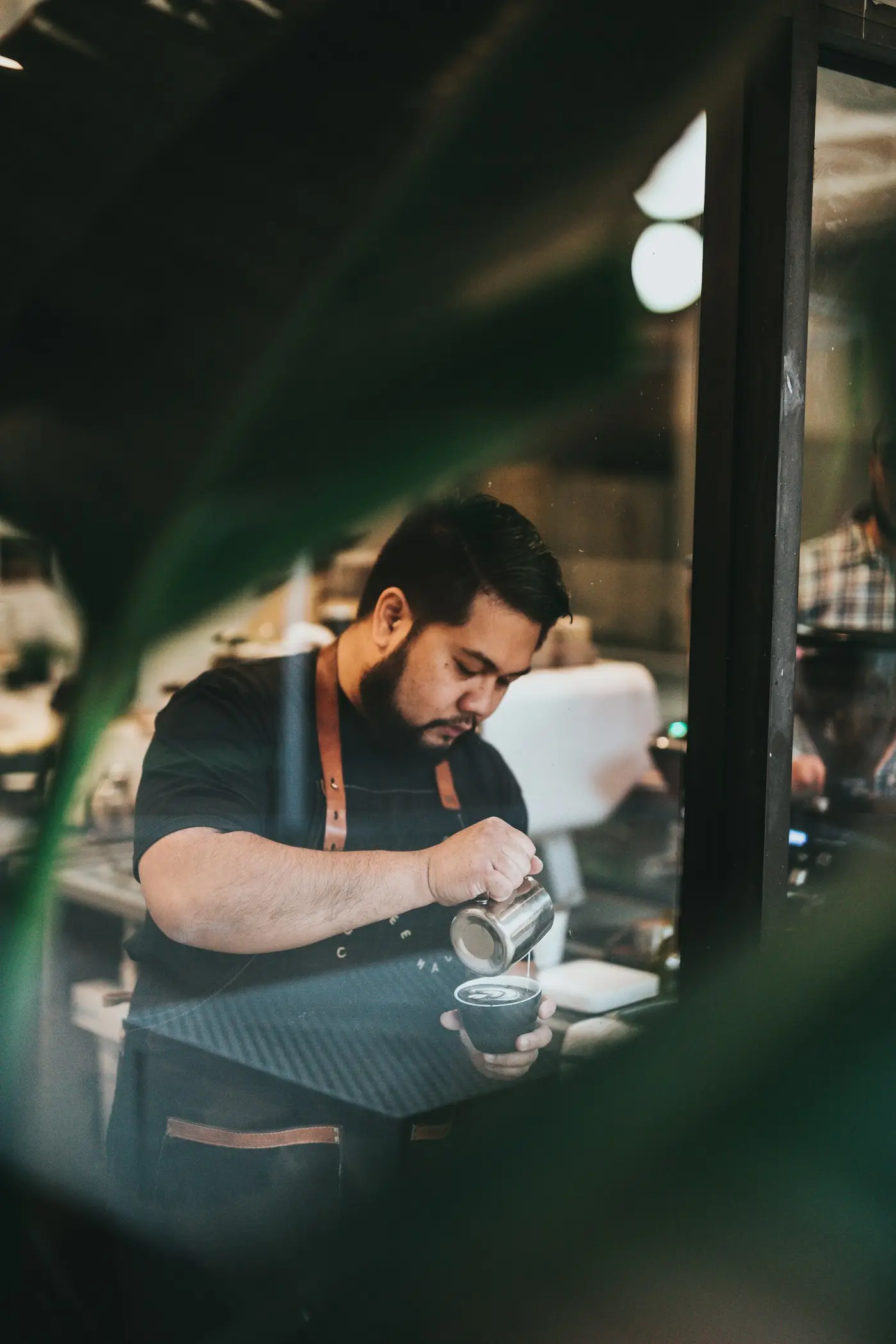 Student barista at work, a reminder to plan your study abroad budget