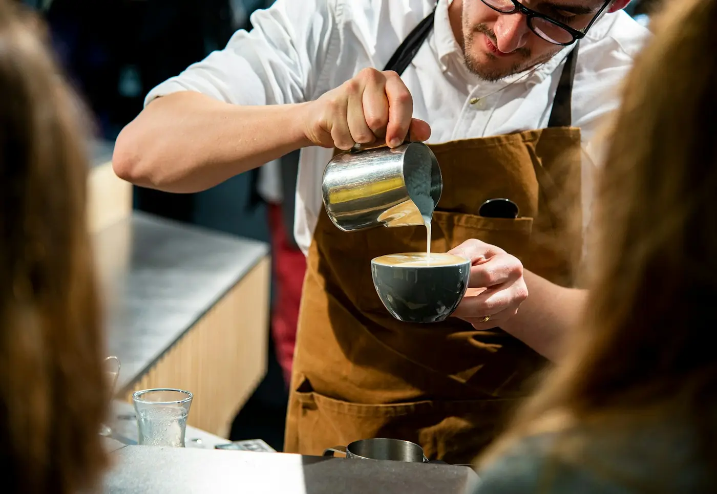 Student working a cafe shift, a reminder that work rights differ by country
