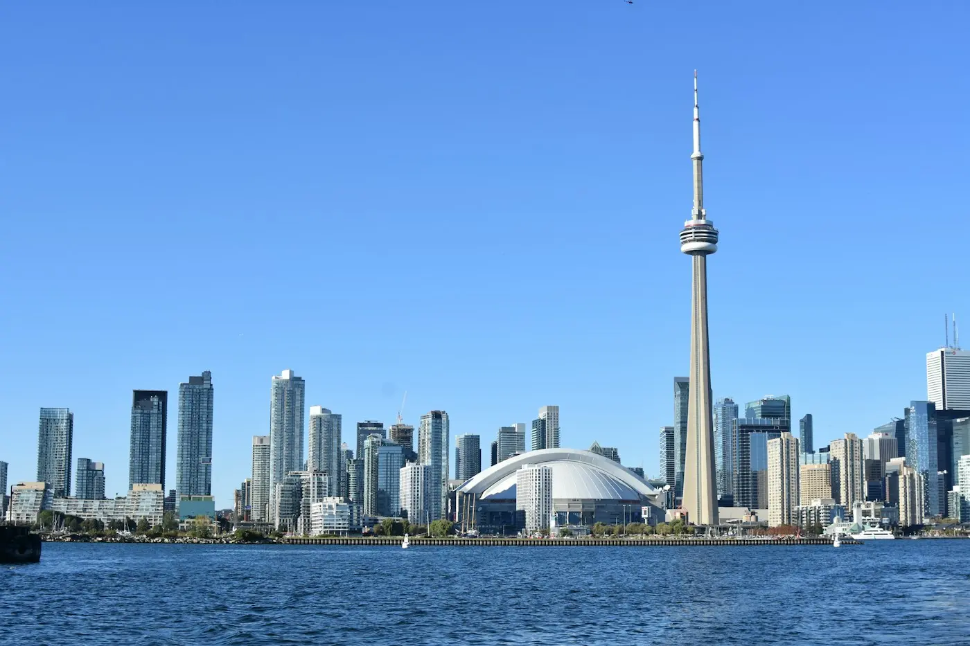 Toronto skyline with the CN Tower, comparing the cost of living for international students in Canada and the USA