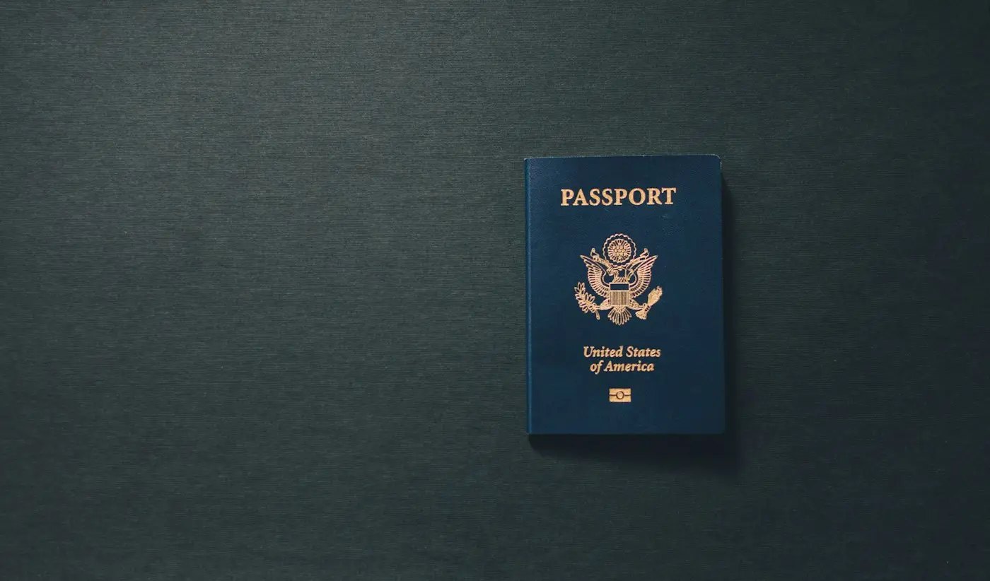 US passport on a dark table, for the F-1 visa interview section